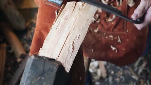 Woodworker Carving Block on Wooden Lathe