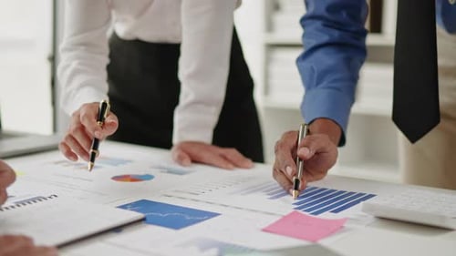 Close up of hands are working and brainstorming on paperworks.