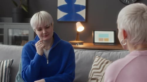 Two Adults Communicating with Sign Language