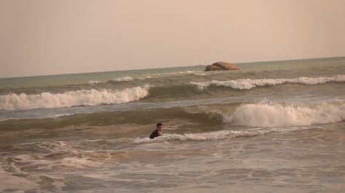 Teenage Boy Surfing On Board In Sea, Super Slow Motion 240fps