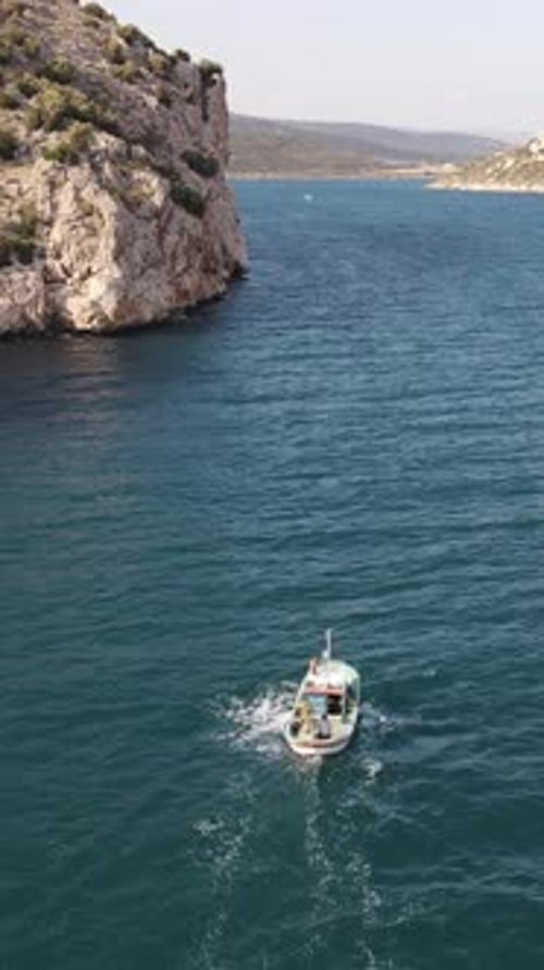 Fishing Boat Sailing in the Bay