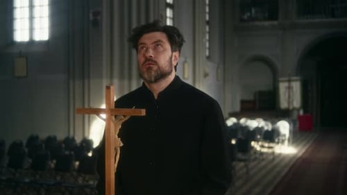 Pastor Looking Above while Praying to God in Church