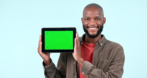 Green screen, tablet mock up and a man in studio with website, internet and social network