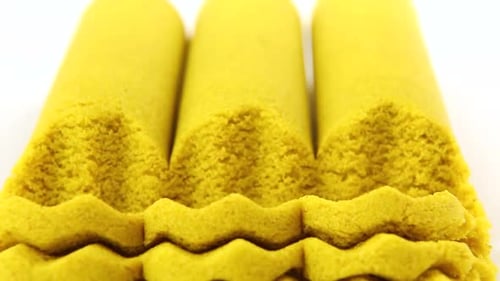 Three Strips of Yellow Kinetic Sand are Cut with a Curly Knife