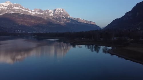 Ascending aerial over the Passy lake and towards the Arve valley