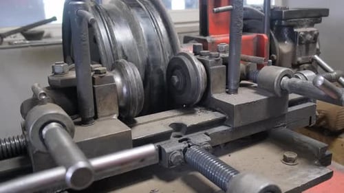 Machine Bending a Metal Wheel in Factory