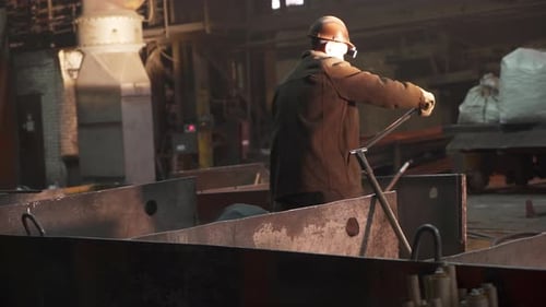 Industrial Scene Featuring a Worker Engaged in a Dynamic Warehouse Environment and Activity Stock