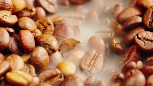 Roasting Coffee Beans with Smoke on Dark Background Close Up Arabica Robusta Colombian Beans