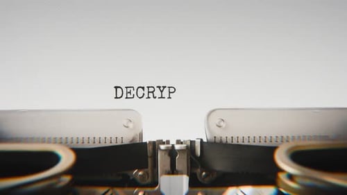 Old mechanical typewriter typing Decrypting Files in a close-up view.