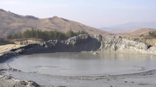 Interesting view mud volcano bubble boiling. Mud Volcanoes stand for one of the most interesting mix