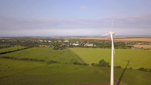 Aerial View of Wind Turbine Generators in Field Producing Clean Ecological Electricity