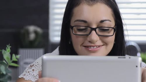 Woman Using Tablet in Bright Home Interior
