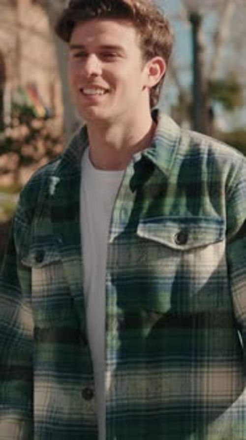 Young loving couple meet on the street, hug and kiss