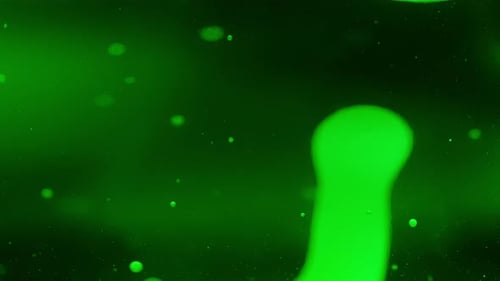 Abstract lava bubbles floating in liquid on a gradient green background