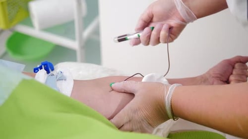 Healthcare Concept Laboratory in Clinic Female Lab Assistant Taking Venous Blood for Test HIV