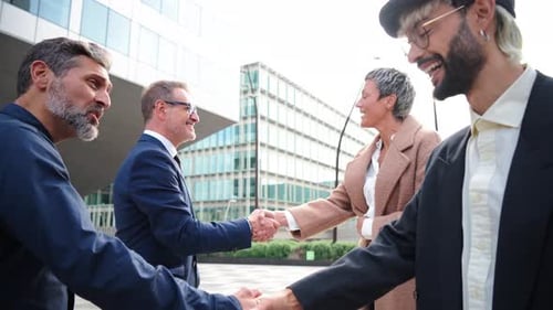 Diverse Professionals Shaking Hands at Business Meeting