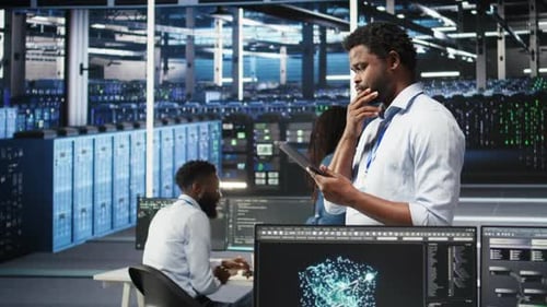 Data Center Engineer Using Tablet to Interpret AI Generated Data Analytics Graphs