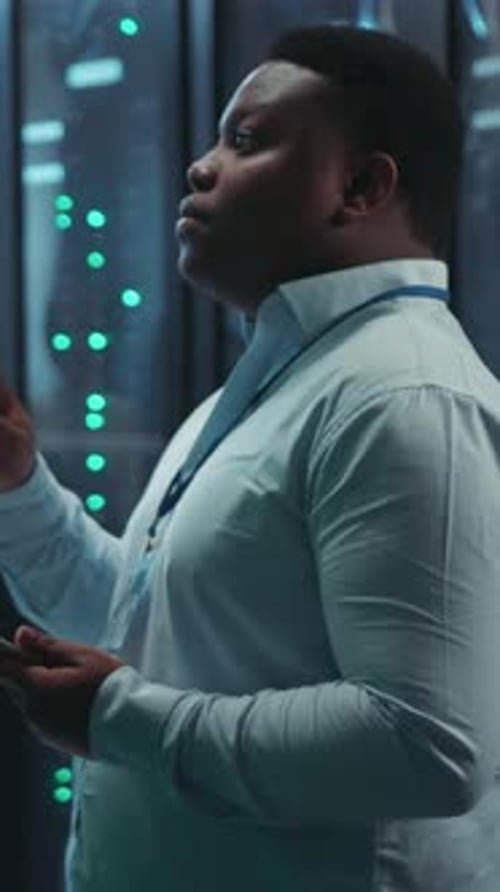 Two Engineers Work in a Server Room