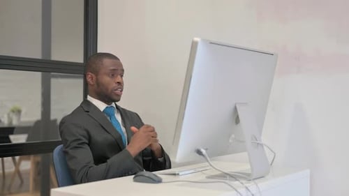Young Adult Man Talking During a Video Call