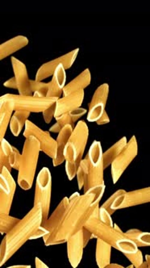 Super Slow Motion Flying Dry Penne Pasta Filmed on a Highspeed Camera at 1000 Fps