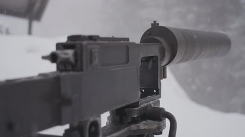 Vintage gun armed aiming in snowfall background WW1