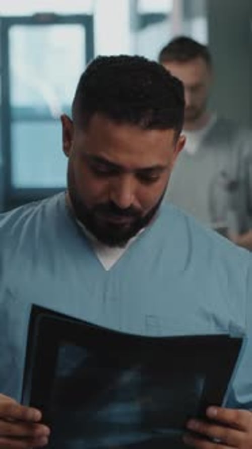 Portrait of Doctor with X-Ray Scans in Hospital