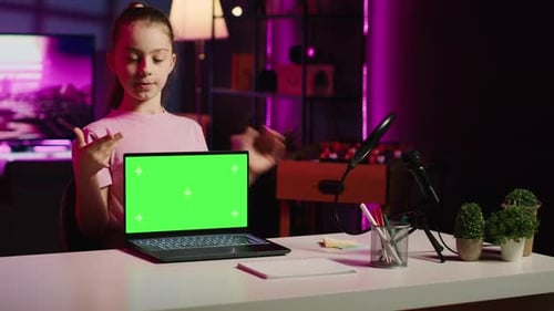 Kid Influencer in Home Studio Using Recording Gear to Record Review of Mockup Laptop