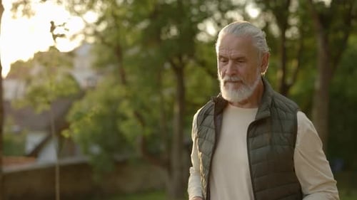 Mature Man is Jogging in the Street