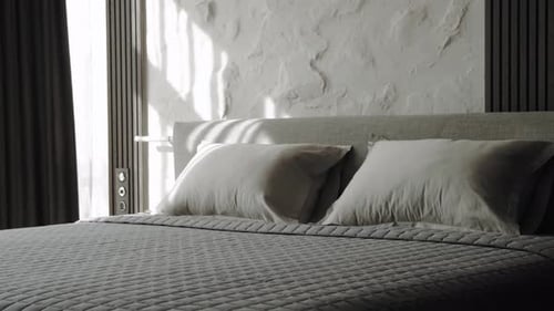 Modern Bedroom Interior with Sunlight Streaming In