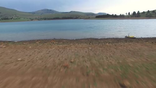 Aerial Drone of Lake and Mountains Against Sky with Holiday