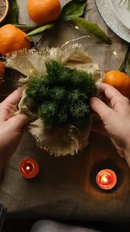 Vertical Video Woman Set Table for Christmas Dinner
