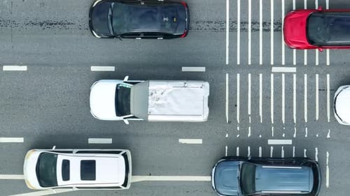 A down view reveals severe traffic jams on a paved city road.