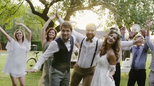 Wedding Party Celebrates Outdoors with Dancing and Laughter