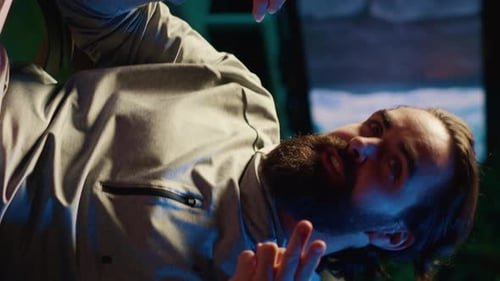 Bearded Man Making Hand Gestures in Studio