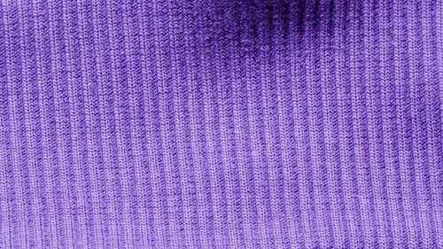 Knitted Warm Purple Sweater or Scarf Macro Close Up Texture Cozy Warm Composition of Wool Fabric