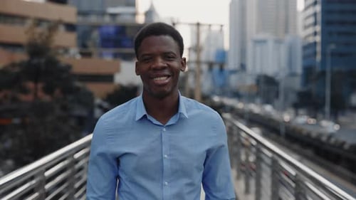 Smiling Handsome Businessman Standing Outdoors in the City Centre African American Guy Outdoors
