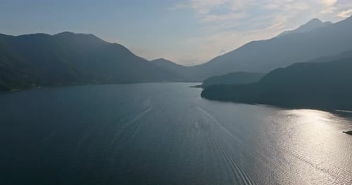 Drone flying over lake Kawaguchi, hazy, summer day in Yamanashi, Japan