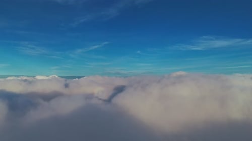 Aerial View Flying Above Fluffy White Clouds Blue Sky