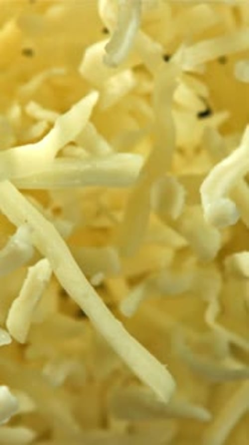 The Grated Cheese Flies Up and Down Filmed on a Highspeed Camera at 1000 Fps