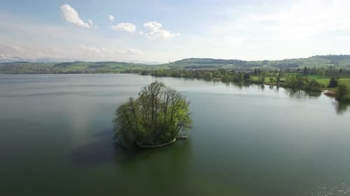 Captivating Scenic Aerial View of a Tranquil Lake Surrounded By an Island and Lush Greenery
