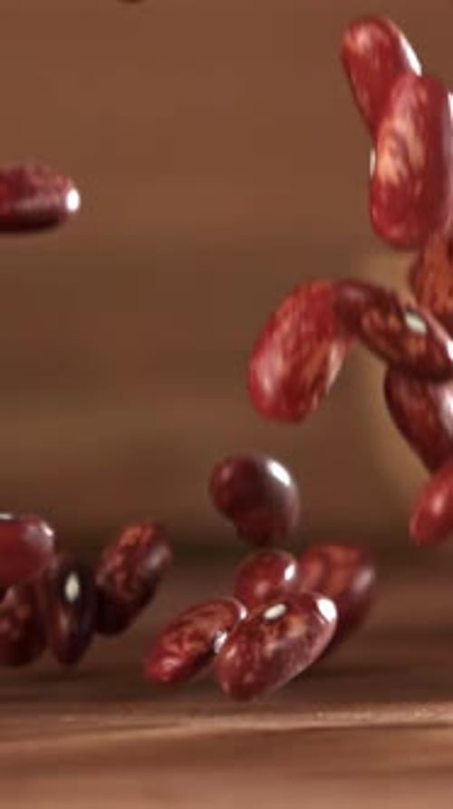 Red Beans Fall on the Table Filmed on a Highspeed Camera at 1000 Fps
