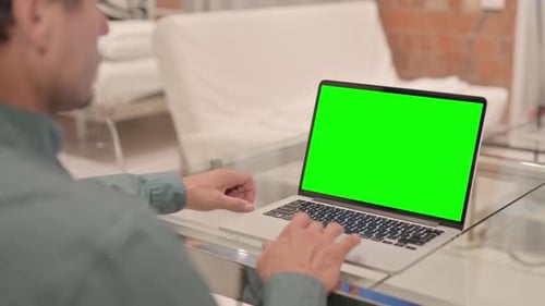 Mature Adult Man Using Laptop with Green Screen