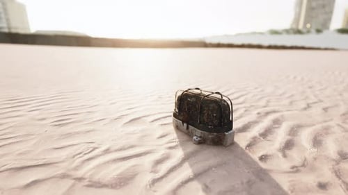 Old Rusted Trash on the Sand Beach
