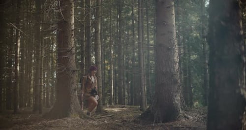 Woman Hiker Hiking Through Dense Forest