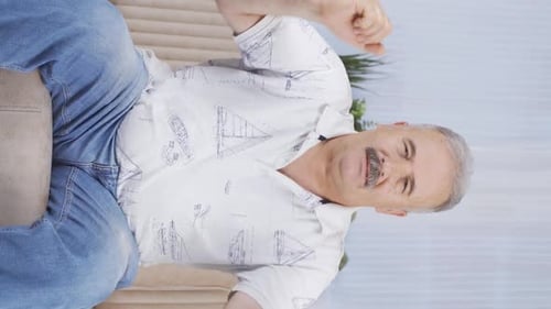 Vertical video of Happy dancing old man full of joy.