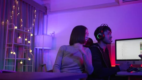 Young Adults Play Video Games at Home