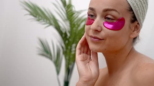Woman with Eye Patches in Bright Room