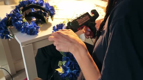 Crafter Attaches Blue Flowers for Elegant Headwear