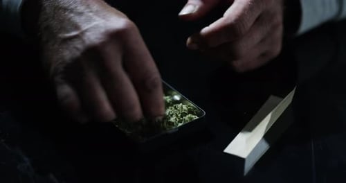 Hands Gathering Green Material Close Up
