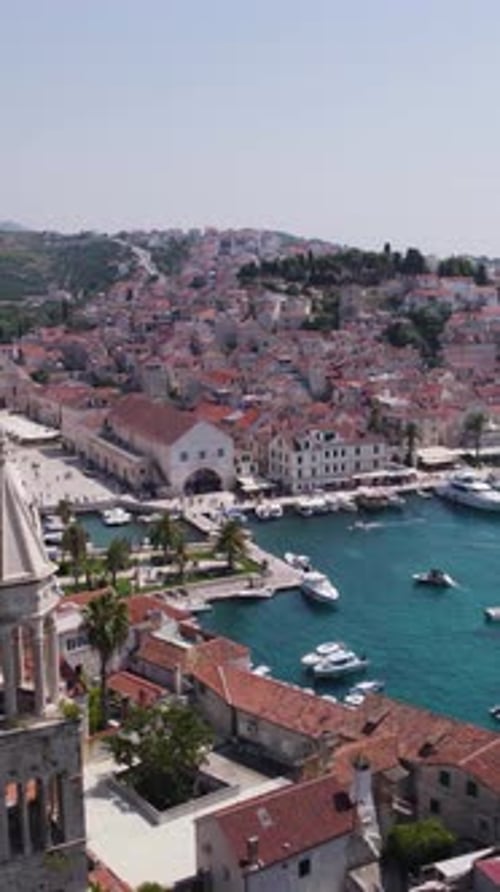 Aerial view of Hvar town, harbor and waterfront on Hvar Island, Croatia. Vertical video